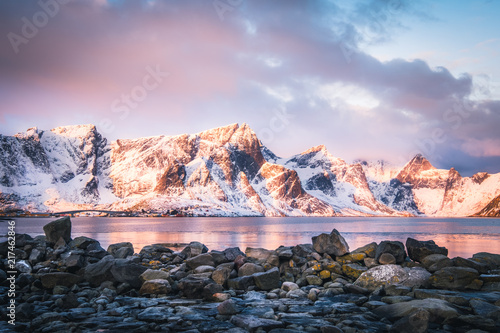 Mountain Landscape covered with snow in Lofoten, Norway at sunrise.