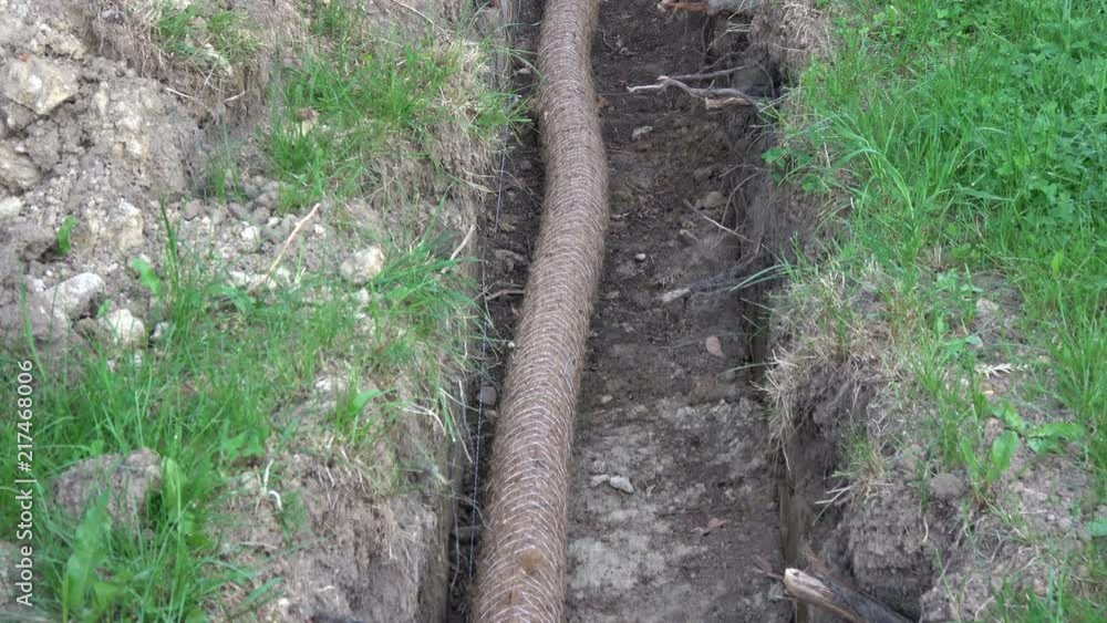 drainage pipe tube in trench on field drainage pipe tube in trench on field