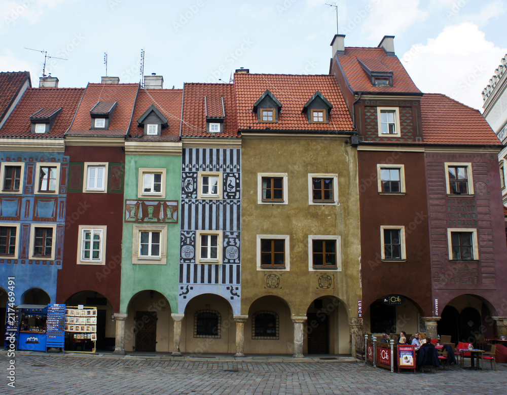 Poznan, Poland - 04/11/2014 - street in old town with colorful houses, market square, sunny day