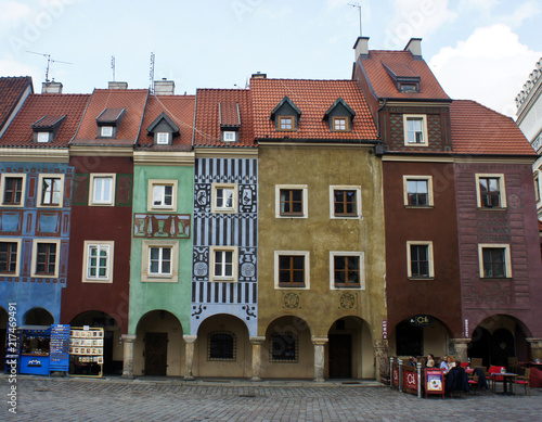 Poznan, Poland - 04/11/2014 - street in old town with colorful houses, market square, sunny day