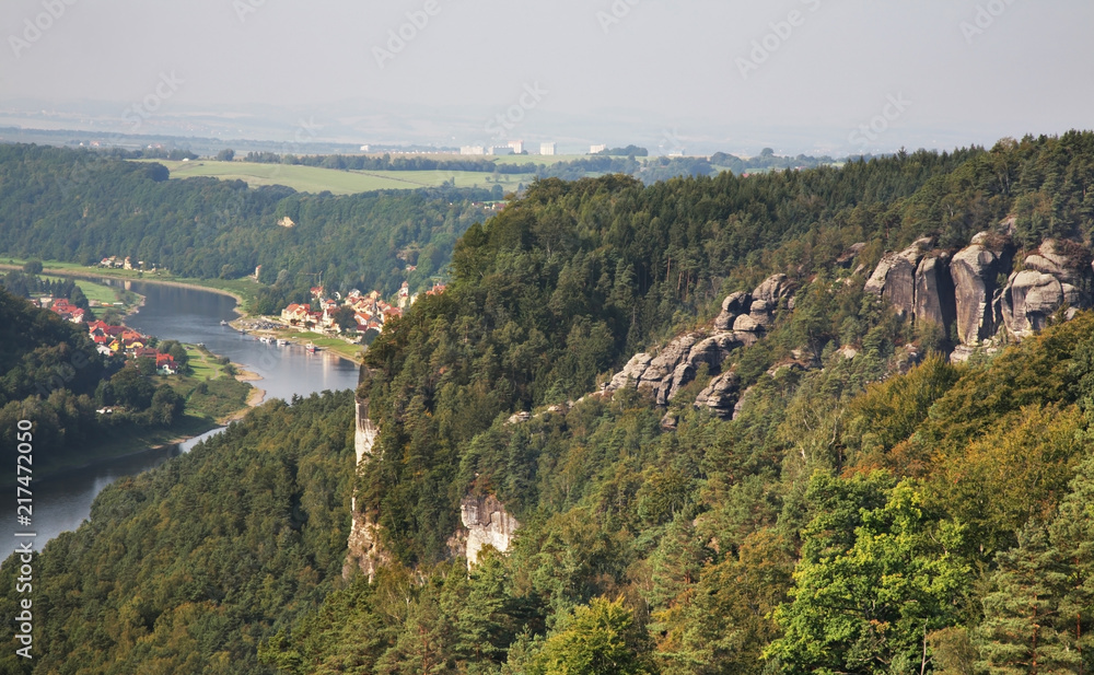 Elbe river and Bastei at Elbe sandstone mountains near Rathen village. Saxon Switzerland National Park. Germany