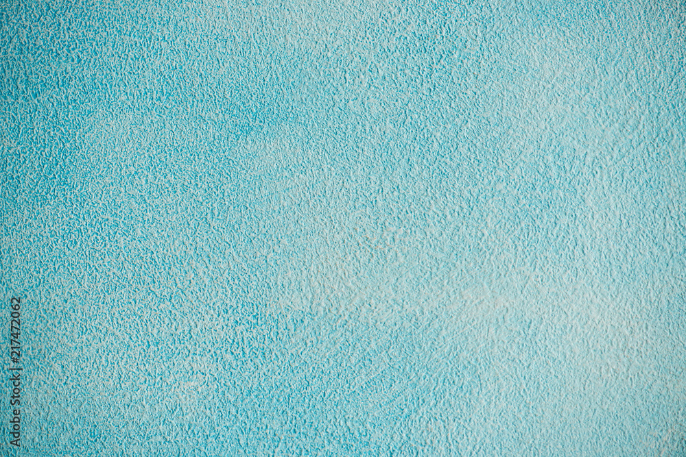 Obraz premium New blue cement wall Beautiful concrete stucco. painted cement Surface design banners.Gradient,consisting,paper design,book,abstract shape Website work,stripes,tiles,background texture wall.