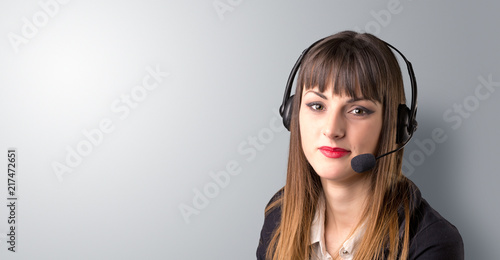 Young female telemarketer on a white background