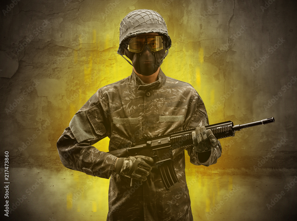 Hazard, menace soldier in a ruined crumbly building with arms on his hand
Hazard, menace soldier in a ruined crumbly building with arms on his hand