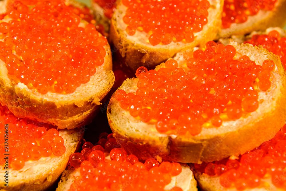 Background of the sandwiches with the red caviar Background of the sandwiches with the red caviar