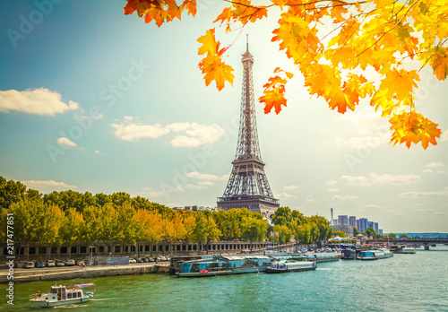 Eiffel Tour over water of Seine river at fall day, Paris, France © neirfy