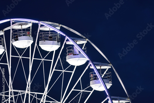 Close up of a ferris wheel at night photo