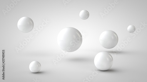 the image of the group of balls of the white drop-shadow  and randomly located in space  on a white background. 3D rendering.