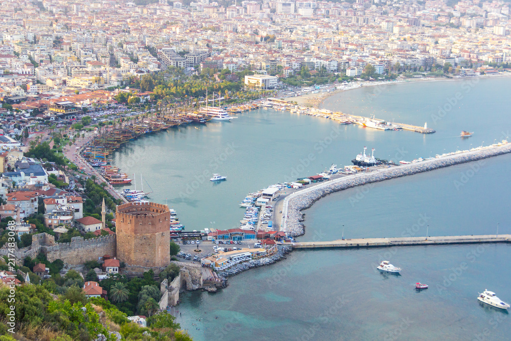 Landscape with marina and Red tower in Alanya peninsula, Antalya district, Turkey