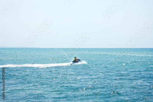 Two men on a water jet scooter in the Mediterranean Sea