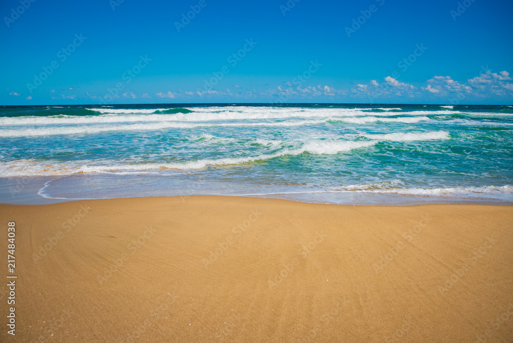 Sandy beach and blue ocean