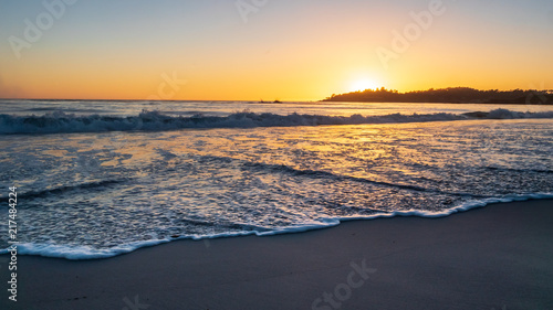 Ocean Water Rushing Toward the Camera During Sunset © porqueno