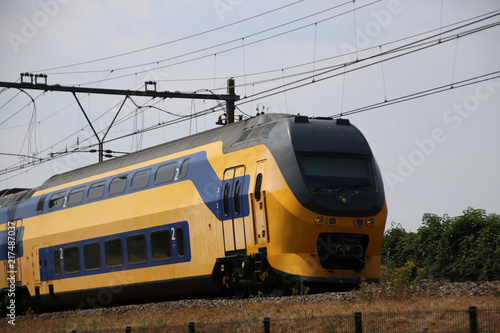 Double decker intercity train on the track at Moordrecht heading to Gouda in the Netherlands.