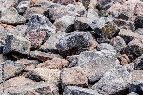 a mass of different sizes of stones of gray and blue color. texture