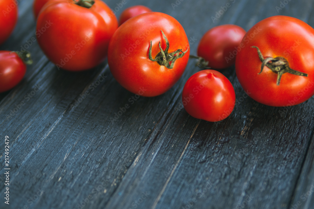 Ripe red tomatoes on a wooden table with copy space Ripe red tomatoes on a wooden table with copy space