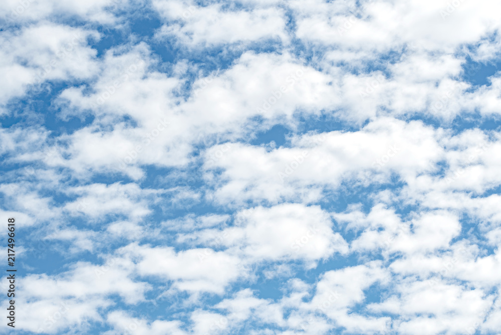 a lot of white clouds on a blue background a lot of white clouds on a blue background