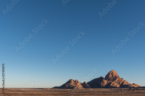 Wide angle shot of Spitzkoppe, granite massive with large blue sky