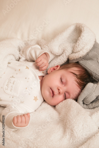  Adorable two months old baby in the bed