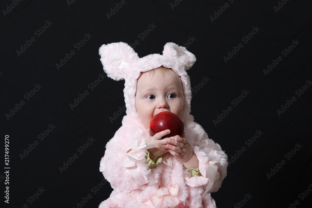 Fototapeta premium Portrait of the baby holding vegetables 