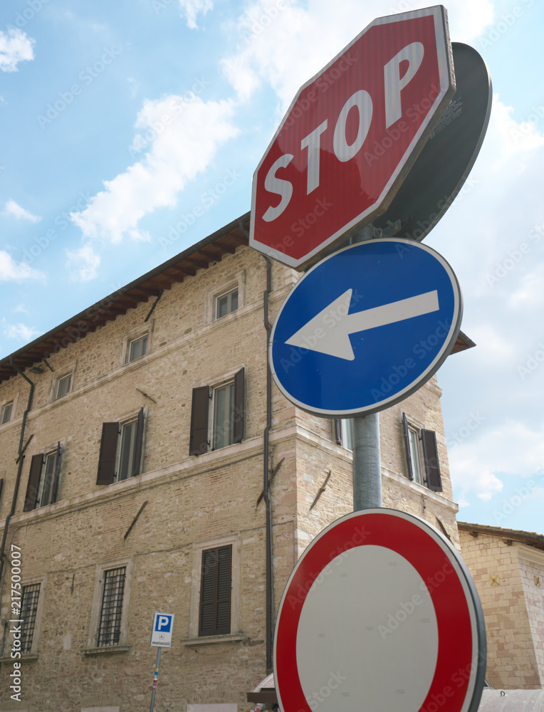 Assisi,Italy-July 28, 2018: Warning road signs of stop and restricted vehicle, Italy