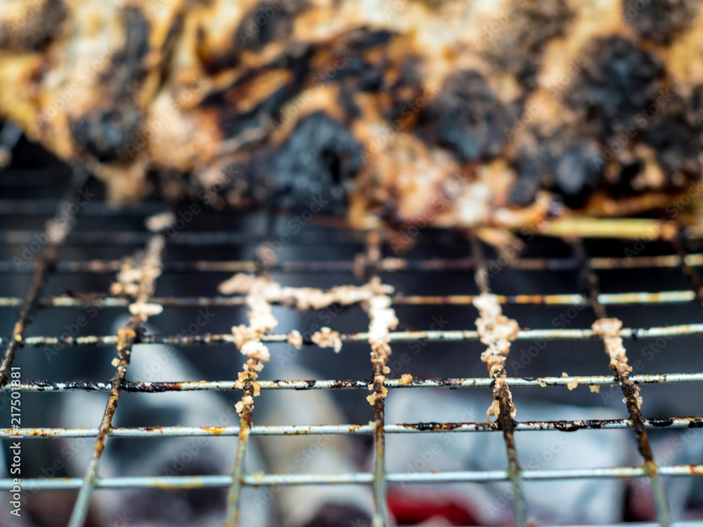 Obraz premium Skin of fish grilled on hot charcoal until black and scorched