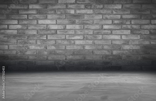 cement floor and brick wall backgrounds, dark room, interior.