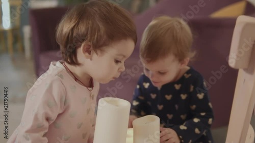 two sisters blow out the candles photo