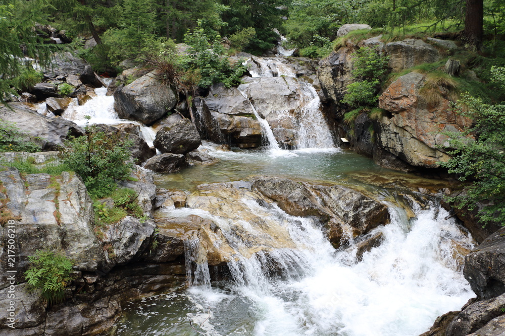 Flowing water from Cascate del Toce in the river Italy Flowing water from Cascate del Toce in the river Italy