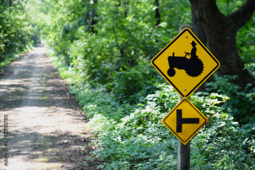 yellow tractor crossing sign