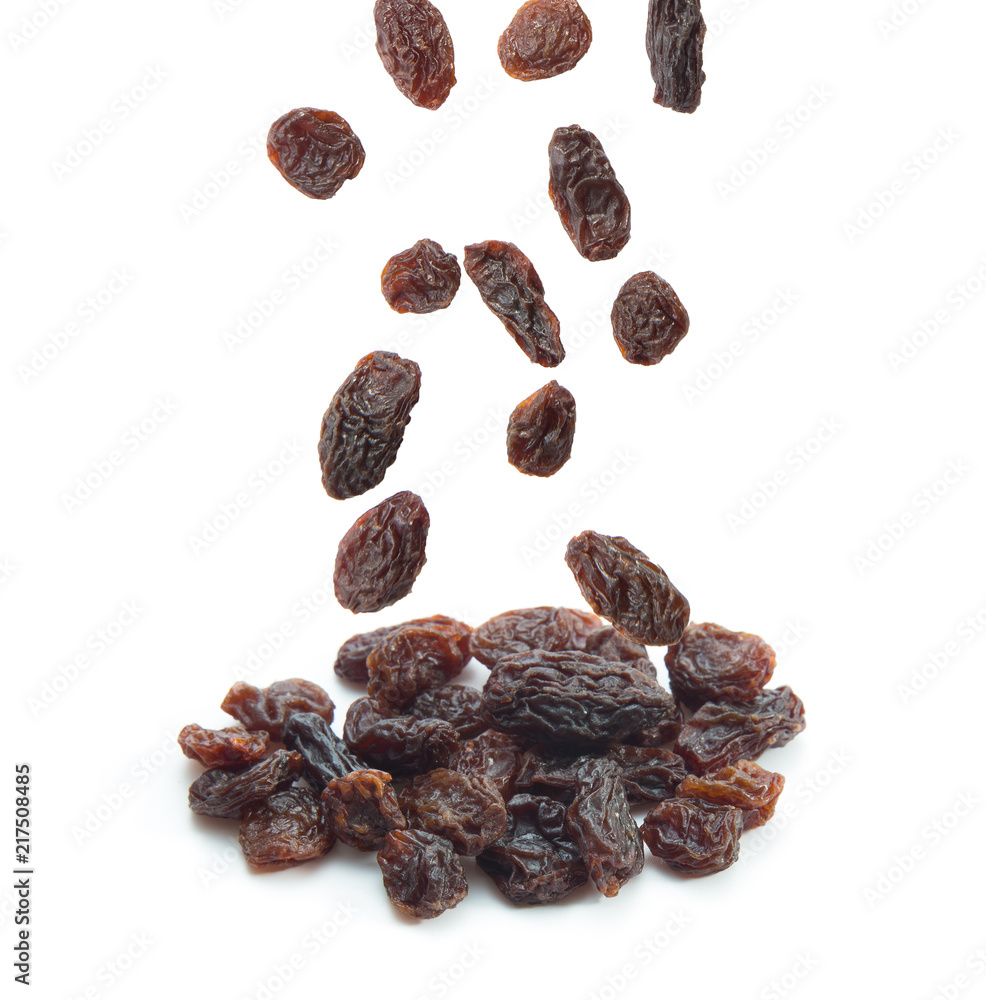 Raisins falling isolated on white background. Raisins falling isolated on white background.