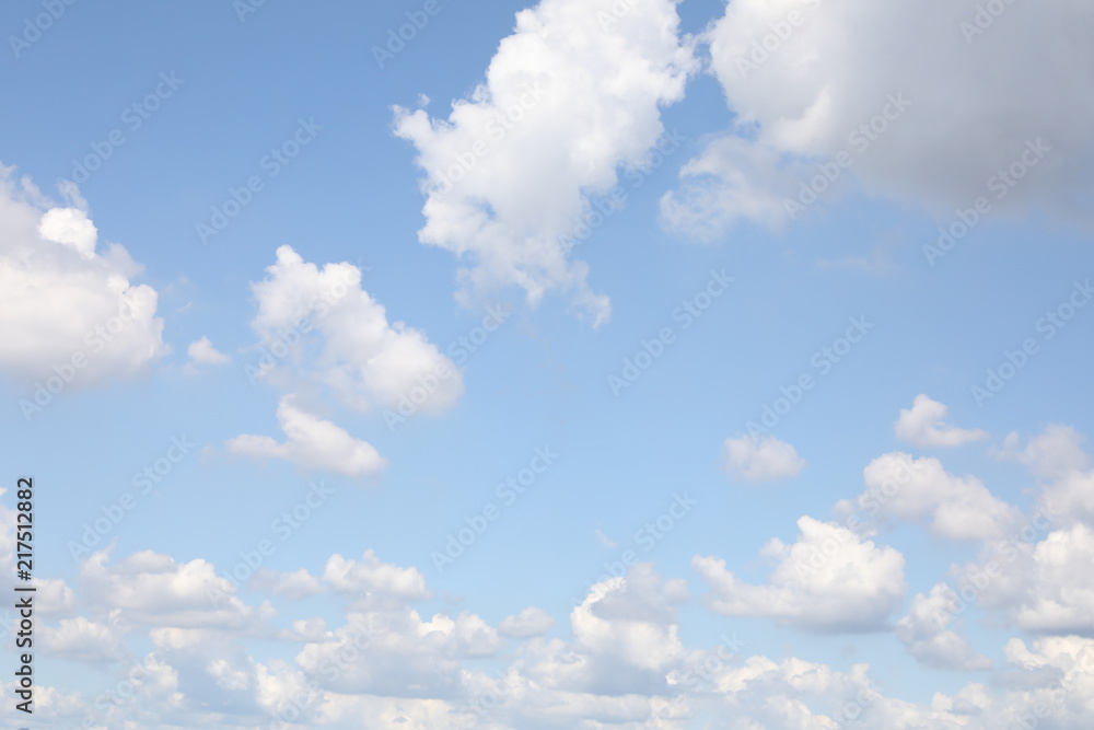 Fototapeta premium Cloudy blue sky abstract background, blue sky background with tiny clouds
