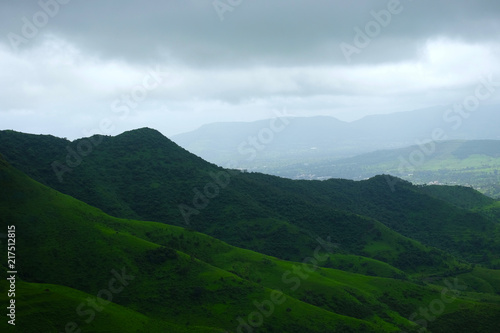 Lush green monsoon nature landscape mountains, hills, farming plot, Purandar, Pune, Maharashtra, India  © Sandeep