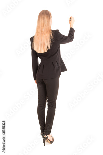 Businesswoman in black suit writing with pen on the screen isolated on white background