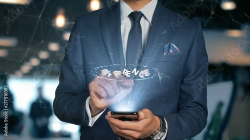 Businessman With Mobile Phone Opens Hologram HUD Interface and Touches Word - EXPERENCE photo