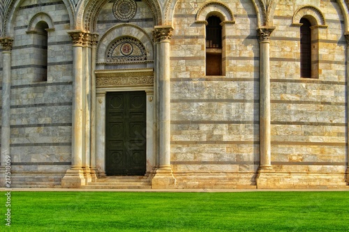 A closeup view of the door and the facade of the baptistery in Pisa  Italy