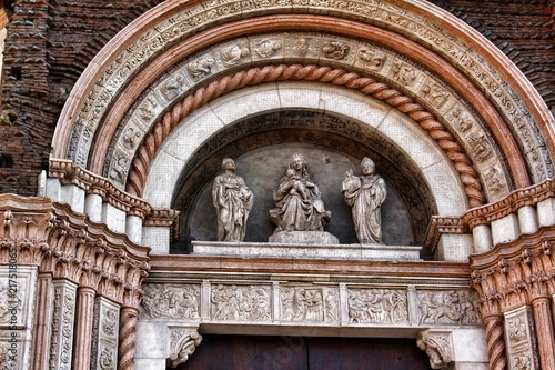 A closeup view of decorative elements of the facade of a cathedral in Bologna, Italy