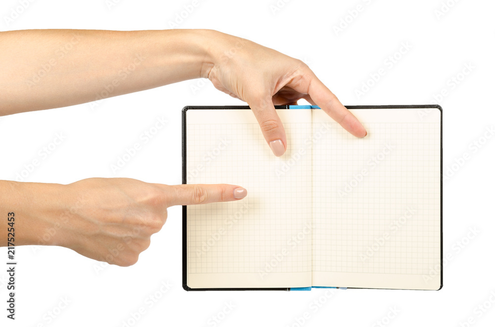 Opened black notebook with hand, isolated on white background Opened black notebook with hand, isolated on white background