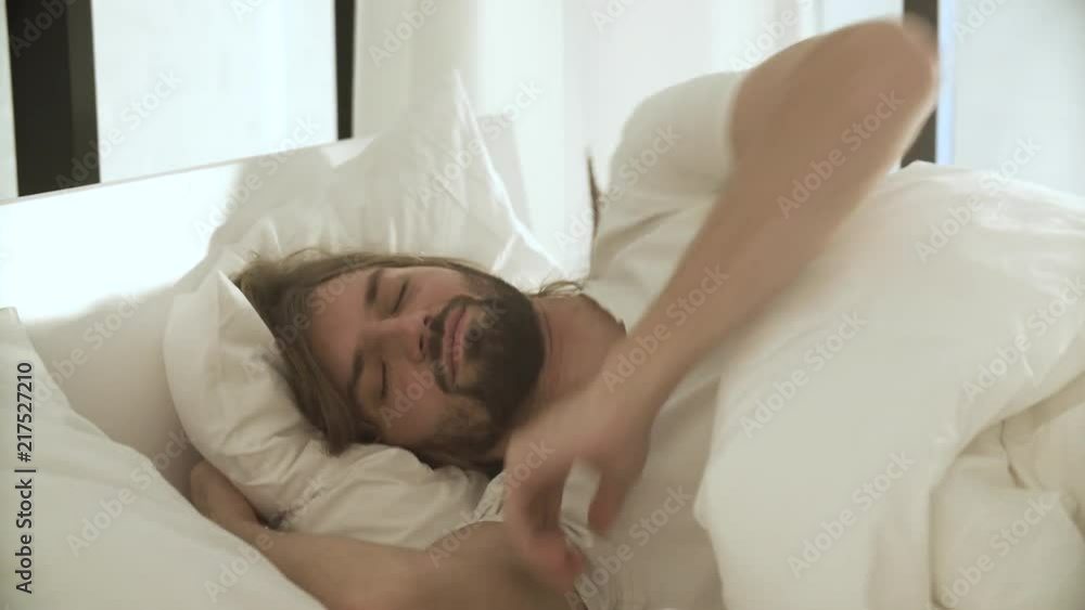Sleeping Man In Bed With White Linens At Light Bedroom Sleeping Man In Bed With White Linens At Light Bedroom