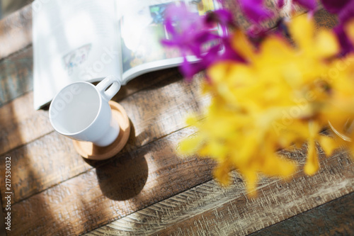 Cup of coffee on a wooden desk