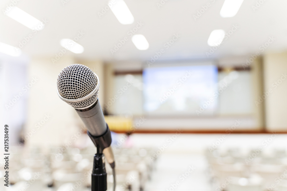 Microphone over the blurred business forum Meeting or Conference Training Learning Coaching Room Concept, Blurred background Microphone over the blurred business forum Meeting or Conference Training Learning Coaching Room Concept, Blurred background