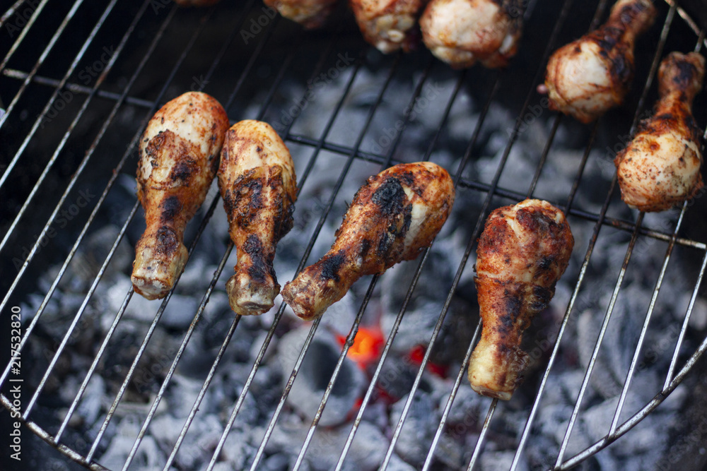 Grillled chicken drumsticks on the open grill