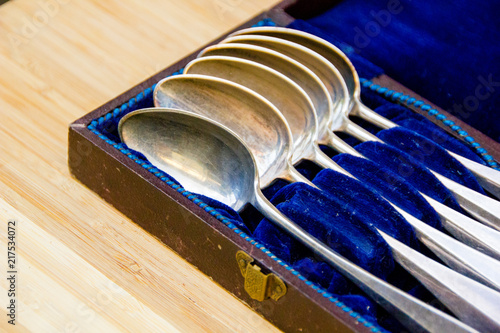 Fotografie An old historic case with blue satin to place silverware spoons inside and keep them stored savely
