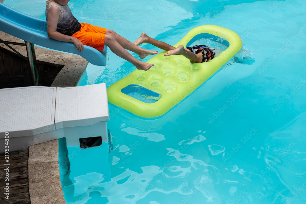 Little boy playing in swimming pool on vacation. Little boy playing in swimming pool on vacation.