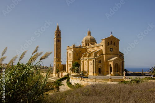 The famous and historical cathedral Ta Pinu on the Maltese island Gozo near Gharb with blue sky