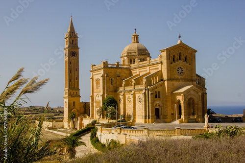 The famous and historical cathedral Ta Pinu on the Maltese island Gozo near Gharb with blue sky