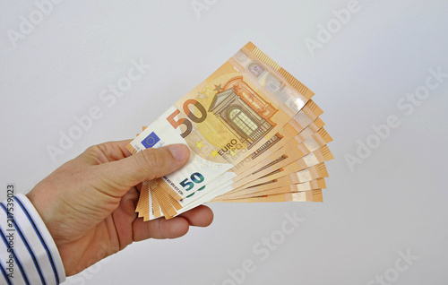 paper money fifty euros in hand photo