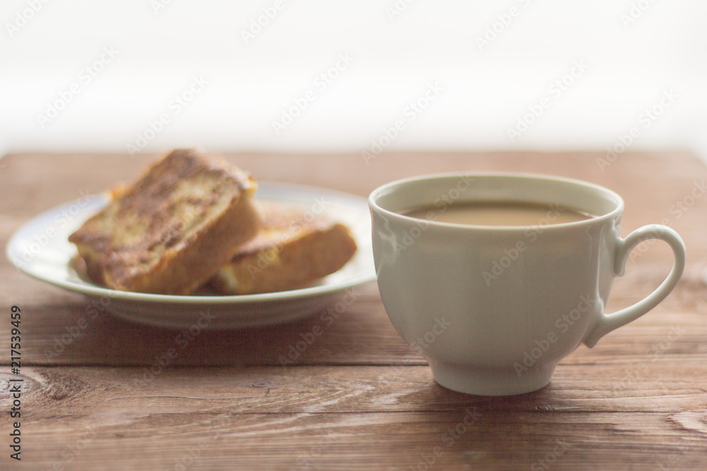 rustic Breakfast, coffee with milk and fried pieces of bread in the egg rustic Breakfast, coffee with milk and fried pieces of bread in the egg