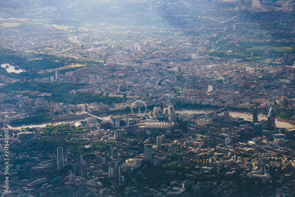 aerial view of the city of London from airplane window seat