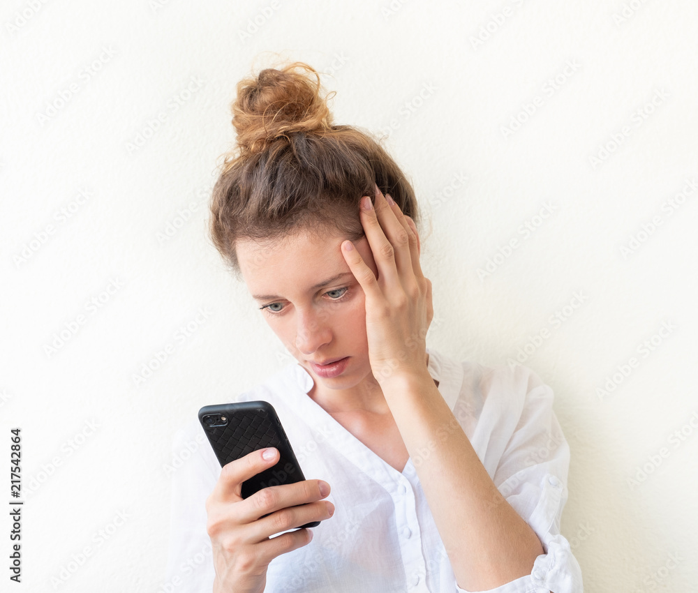 Businessman reads a notification on her mobile phone Businessman reads a notification on her mobile phone