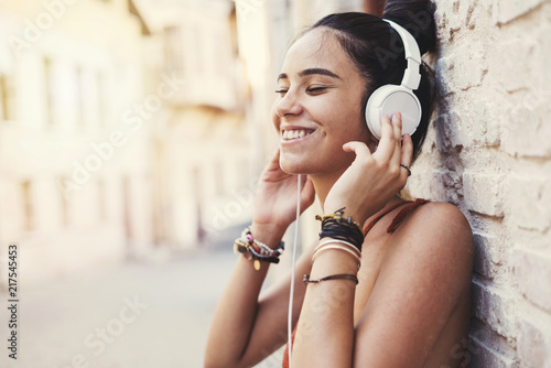 Beautiful young girl listening music